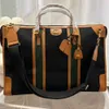 High-End Men's Travel Bag design axel handväska topp märke läder tryck spel tote bagage kvinnor mode utomhus affärs bred axel rem crossbody väska