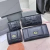 Nya mäns avslappnade plånböcker Läder Kvinnor Purse lyxvarumärke Fashion Crocodile präglade vanligt mönster Långt och kort timglasskylt Plånbok