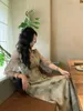 Xiaoren Yixin w stylu chiński zielony druk w talii Specjalny interes 2023 Nowa spódnica w stylu drapowania