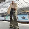 Mäns jeans streetwear tungt hantverk tvättade nödställda bländade flare slim rak tofs för män och kvinnor råa kant denim byxor 230907