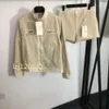 23SS Diseñador Mujer Otoño e Invierno Jersey de manga larga Top corto Cardigan Carta de moda Combinación de cuero Ropa casual Media falda Conjunto Pantalones