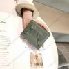 Neue kurze Brieftaschen Modedesign genietet Geldscheinklammer Schicht Rindsleder authentische Damen-Kartentasche Luxus-Freizeit-Multifunktions-Münzbrieftasche