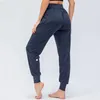 LL Women Yoga Ninth Pants Running Fitness Joggers z kieszenią kieszonkową Elastyczne spodażne spodnie do joggingu 4 kolory D12368248N