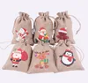 Jul Burlap Linen Drawstring Bag Gift Wraps Santa Claus Snowman Penguin Elk Candy Jewelry Packaging Presentförvaringspåsar Xmas Favors Decoration SN6258