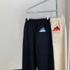 Męskie spodnie jakość Luo yijia mały płomień haft haft proste lampę swobodne spodnie dla mężczyzn i kobiet z amerykańską marką mody Pants strażnik
