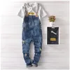 Mäns jeans herrar casual denim jumpsuit mager jean overall rippade vintage bib byxor manliga hängslen 71403240g