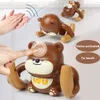 Intelligence toys Voiceactivated Induction Cartoon Scrolling Toy Baby Light Music Flipping Monkey Piggy Children Interactive Gift 230911