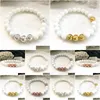 Perlé Mg0888 Golded Lave Bracelet de perles de coquillage pour femmes Amour Énergie Couronne Chakra Pierre précieuse Mise à la terre Drop Livraison Bijoux Bracel Dhgarden Dhphp