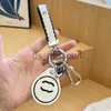 Beanieskull Caps Keychain Luxurys Designers Key Chain Car Solid Color Keychains Metallic Access Card Design Versatil Fashion Leisure Men Women Pick Pen J230909