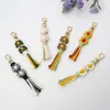 Bohême gland bricolage tissé à la main sac pendentif porte-clés fleur chrysanthème accroche coton corde porte-clés bijoux de mode