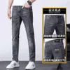 Printemps été jean jeunes hommes brodé coupe ajustée petit pied élastique décontracté tendance Pants208B