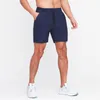 Shorts pour hommes entraînement avec poches solide Fitness Jogging sport cordon confortable entraînement pantalons de vêtements de sport