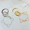 с дизайнером коробки для ключей Anagram Женская сумка шарм золотоир -keyring из нержавеющей стали мужская цепочка моды Классическое кольцо клавиша клавиши