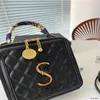 Sac à main de luxe de styliste pour femmes, sac à bandoulière asymétrique épaule dénudée, sac de maquillage rétro à la mode