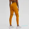 Aktywne spodnie L019A Nagie uczucie legginsy Pants Yoga Spods Sports z kieszonkową kieszonką Lekkie maślane rajstopy dla kobiet x0912