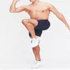 Shorts pour hommes entraînement avec poches solide Fitness Jogging sport cordon confortable entraînement pantalons de vêtements de sport