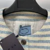 Kurtki damskie projektant luksusowy dzianinowy haftowany swetra designerski wełniany paski design na guziki na guziki ciepły garnitur jbk4