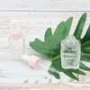 Flacone contagocce quadrato per olio essenziale da 20 ml Flaconi per siero in vetro trasparente da 30 ml con tappo rosa per cosmetici Gjers