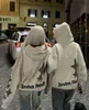 Hoodies للنساء للبلوزات الرغوة خطاب طباعة غرافيتي كروسيك هوديي للرجال والنساء تصميم متخصصة المعنى y2k ملابس فضفاضة أعلى ملابس الشتاء النساء 230911