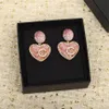 Orecchino pendente con ciondolo 2023 con diamante rosa e bianco in design rotondo a forma di cuore placcato in oro 18 carati