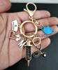 Key Rings Keychains Lanyards New Drip Oil Keychain Doctor Medical Tool Stethoscope Syringe Mask Key Ring Nurse Student Gift 26 Letters Chains Dr yc x0914