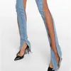 Jeans femininos nicho sexy para mulheres outono espiral oco design de malha com uma sensação de costura e calças divididas tendência