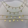 Celi Arc de Triomphe Letter Sign Sign Double Layer Halsband med full diamantguldkrage Ljus och lyxkänsla liten kedja