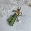 Nyckelringar Designer Keychain Luxury Key Chain Bag Charm Female Car Key Ring Pearl Charm Green Ribbon Delicate Shells Keychain Par Pendant Gift Nice X0914