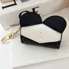 Llaveros clásicos Cordones de diseñador para estuches para auriculares Bolsos de mujer Colgantes Gato Panda Llavero Mosquetón Llaveros Hombre Pareja Cordón