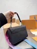 新しいツイストデニム2023ファッションクラシックバッグデザイナーバッグハンドバッグレザーハンドバッグ女性クロスボディレトロハンドバッグショルダークロスボディバッグウォレットショッピングバッグ