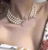 Multilayer Designer Pearl Rhinestone Viviene Westwood Halsband CLAVICLE CHAVE CHAMED BAROQUE NECKLACES FÖR KVINNSMEYGGRÅD