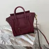 High quality designer bag micro luggage handbag in calfskin crossbody bag with leather handles zip closure and a zipped outer packet on the front