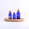 Frosted Blue Glass Droper Bottle 5 ml 10 ml 15 ml 30 ml 50 ml med bambu lock cap 1oz bambu eteriska oljeflaskor jgosm