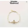 Pulsera de perlas con alfiler viuda de la emperatriz occidental con incrustaciones de diamantes de Vivian Saturn de alta versión