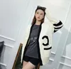 23SS Designer Femmes France Style Pull Lettre Imprimer Tricot Col V Manches Longues Lâche Mode Solide Blanc Noir Couleur Pull Tricoté Femmes Top Coat vêtements