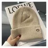 Net red knitted hat smiley face marked hair baotou line hat women autumn and winter cute trend all wear warm pullover hat men