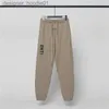 Survêtements pour hommes Pantalons pour hommes pantalons décontractés pour femmes longue bande élastique couleur unie noir et blanc lettres grises adhésif pressé vêtements décontractés à la mode