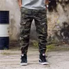 E-BAIHUI moda masculina camuflagem calças de jogging com zíper macacão feixe pé calças irregulares hip hop designer masculino jumm311s