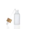 Frasco conta-gotas de vidro branco fosco 10ml 15ml 20ml 30ml 50ml com tampa de bambu 1oz frascos de óleo essencial de madeira Bsooh
