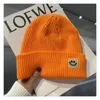 Net red knitted hat smiley face marked hair baotou line hat women autumn and winter cute trend all wear warm pullover hat men