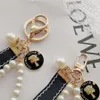 Designers Fashion Keyring Keychains Luxury Brands Pearl Handmade Keyrings Women Lovers Couple Bags Cars Key Chains Lanyards287l