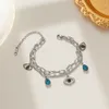 Bracelet démon de bijoux de créateur style de mode européen et américain matériau en acier titane ne se décolore pas décoration de la main classique INS vent net argent rouge