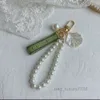 Designer Chain Bag Kvinnlig bil Key Ring Pearl Charm Green Ribbon Delicate Shells GGG KeyChain Par Pendant Gift Nice