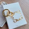 Designer Car Key Carabiner Keychains Mens Anagram Pendants LoweeeYiwi Key Chain Lover Couple Bags Pendants Luxury Metal Keyrings Silver Gold Keys