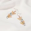 Pendientes colgantes dorados y blancos, mariposa hueca, ostentosa, cristal estrellado transparente, gota de aleación para mujer