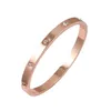 Bracciale rigido La bellissima coppia Bracciale zirconi in oro con gioielli da donna in acciaio inossidabile Carta regalo Fibbia Brac2486