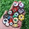 Wholesale 100Pcs PVC Horrible Eye Flower Candle Mushroom Fire Sandals Buckle Shoe Charms Boys Girls Decorations For Button Clog Backpack