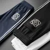 Joggers dresowe spodnie hip-hopowe spodni 3 kolory moda haftowane boczne paski mężczyźni kobiety długie sznurka