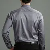 Camisas casuais masculinas 6xl outono e inverno força elástica não-ferro homens de mangas compridas camisa casual de negócios cor sólida camisa vertical mercerizada 230918