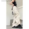 Kvinnors jumpsuits Rompers American Ins Vintage White Overalls Women's High Street Hiphop Multi-Pocket Design Lossa Wide-Ben Casual Pants L230918